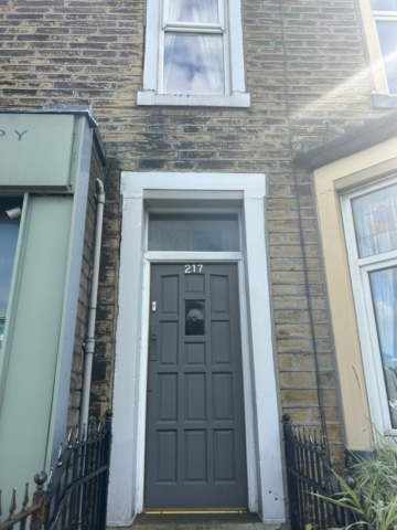 Front door of a 3 bedroom flat available for rent with The Lettings Cloud located on Burnley Road, Colne